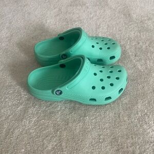 Mint green crocs women’s 7, kids 5